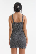 Load image into Gallery viewer, Show your best assets in this abstract dot printed, body con mini dress. Featuring ruffled straps, a tied sweetheart neckline and smocking throughout, find yourself looking for this dress on those sweet yet sexy occasions life may bring.
