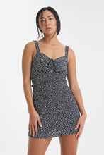 Load image into Gallery viewer, Show your best assets in this abstract dot printed, body con mini dress. Featuring ruffled straps, a tied sweetheart neckline and smocking throughout, find yourself looking for this dress on those sweet yet sexy occasions life may bring.