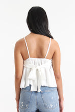 Load image into Gallery viewer, Our babydoll, adjustable spaghetti strapped, tie bow back blouse is made out of a textured woven. With its sweet silhouette, consider this a summer staple paired with a classic heel or casual sneaker.