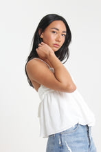 Load image into Gallery viewer, Our babydoll, adjustable spaghetti strapped, tie bow back blouse is made out of a textured woven. With its sweet silhouette, consider this a summer staple paired with a classic heel or casual sneaker.