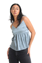 Load image into Gallery viewer, Having a beautiful silky sheen to it, introduce the color, cloud blue into your closets. With a babydoll silhouette, this blouse is completed with adjustable spaghetti straps & smocked back detailing.