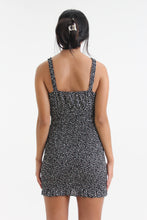 Load image into Gallery viewer, Show your best assets in this abstract dot printed, body con mini dress. Featuring ruffled straps, a tied sweetheart neckline and smocking throughout, find yourself looking for this dress on those sweet yet sexy occasions life may bring.
