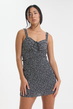 Load image into Gallery viewer, Show your best assets in this abstract dot printed, body con mini dress. Featuring ruffled straps, a tied sweetheart neckline and smocking throughout, find yourself looking for this dress on those sweet yet sexy occasions life may bring.
