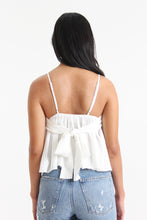 Load image into Gallery viewer, Our babydoll, adjustable spaghetti strapped, tie bow back blouse is made out of a textured woven. With its sweet silhouette, consider this a summer staple paired with a classic heel or casual sneaker.
