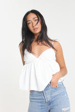 Load image into Gallery viewer, Our babydoll, adjustable spaghetti strapped, tie bow back blouse is made out of a textured woven. With its sweet silhouette, consider this a summer staple paired with a classic heel or casual sneaker.
